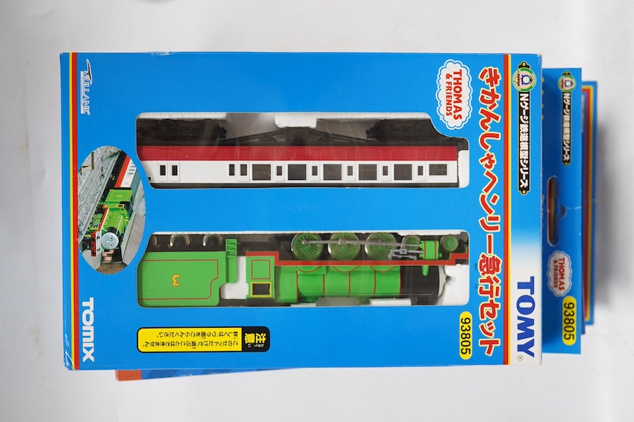 Four boxed Tomix (by Tomy) N gauge railway Thomas the Tank Engine & Friends train packs, comprising of three locomotives and rolling stock (one locomotive missing): James (93802), Henry (93805), Percy (93808) and Thomas
